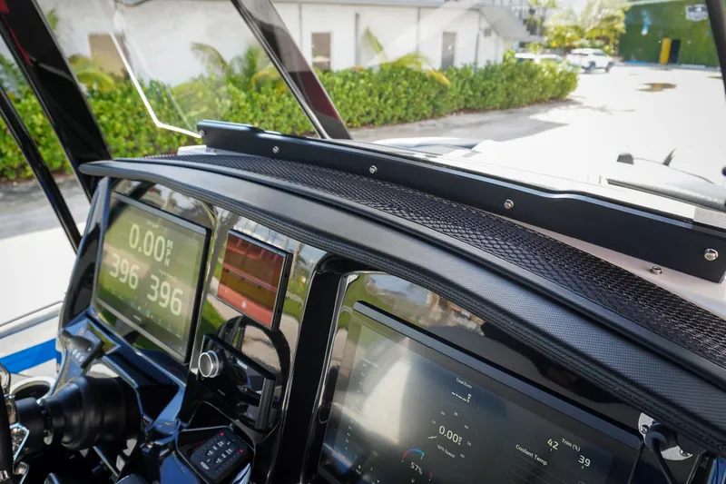 Never Enough Yacht Photos Pics 2023 Sunsation 32 CCX dashboard with modern digital displays and controls.