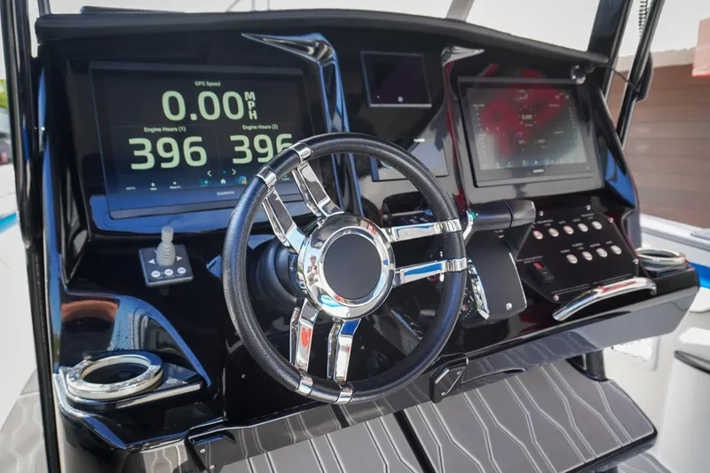 Never Enough Yacht Photos Pics 2023 Sunsation 32 CCX boat dashboard with modern controls and digital displays.