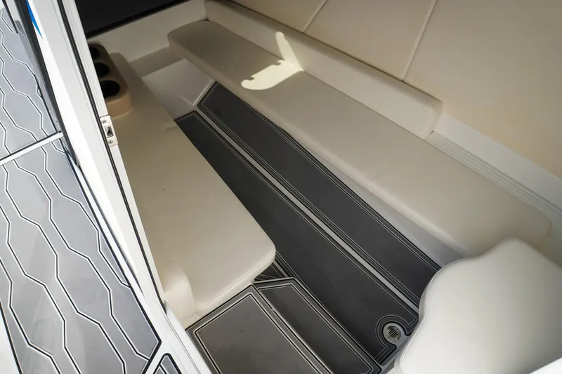 Never Enough Yacht Photos Pics 2023 Sunsation 32 CCX interior with sleek seating and modern flooring design.