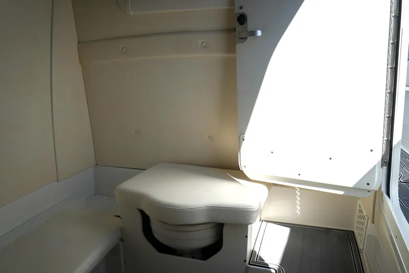 Never Enough Yacht Photos Pics 2023 Sunsation 32 CCX interior cabin with seating and storage.