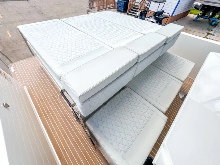  Yacht Photos Pics 2024 De Antonio Yachts D28 Open with luxurious white quilted seating.