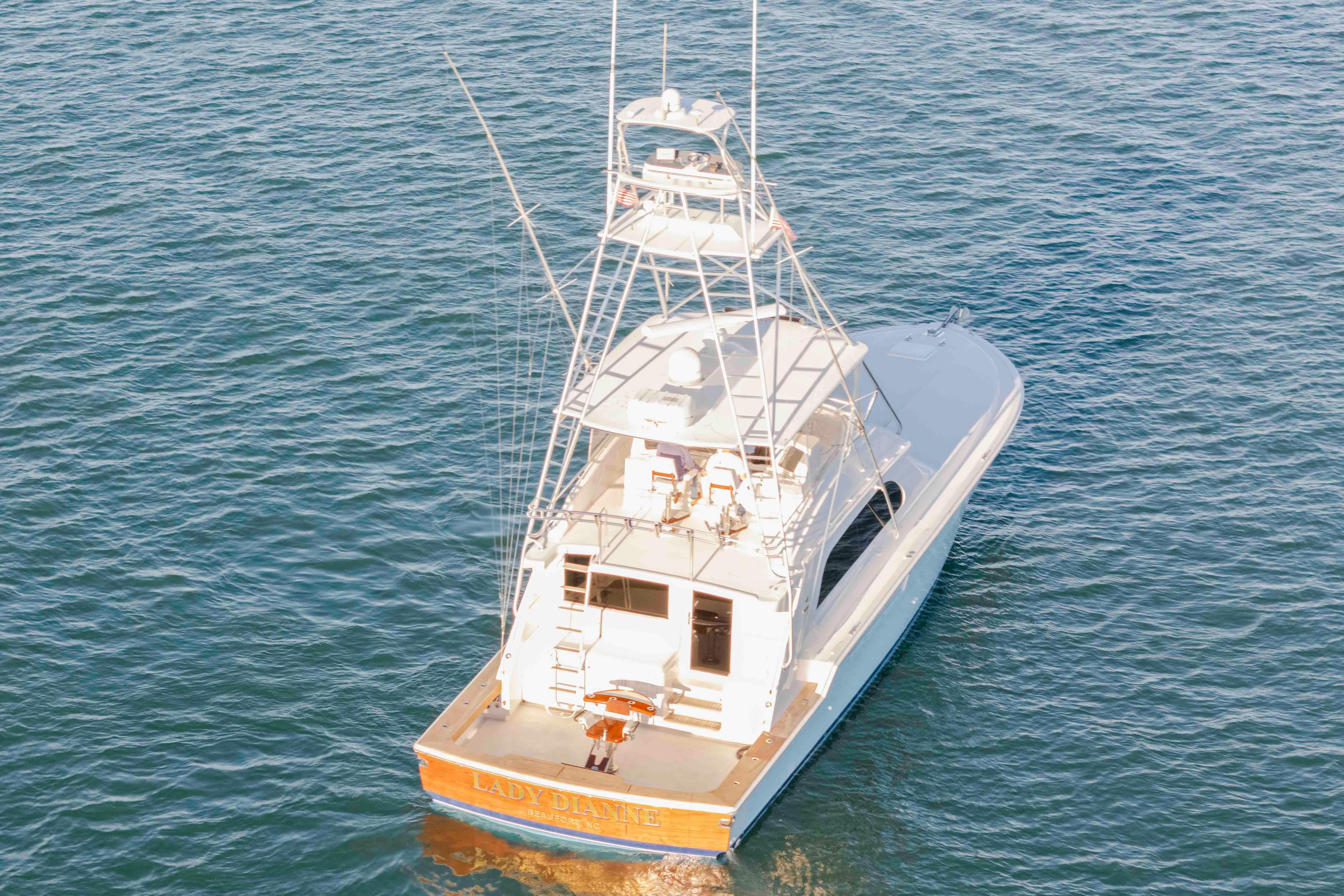 1999 Bertram 60 Convertible yacht on open water, rear view.