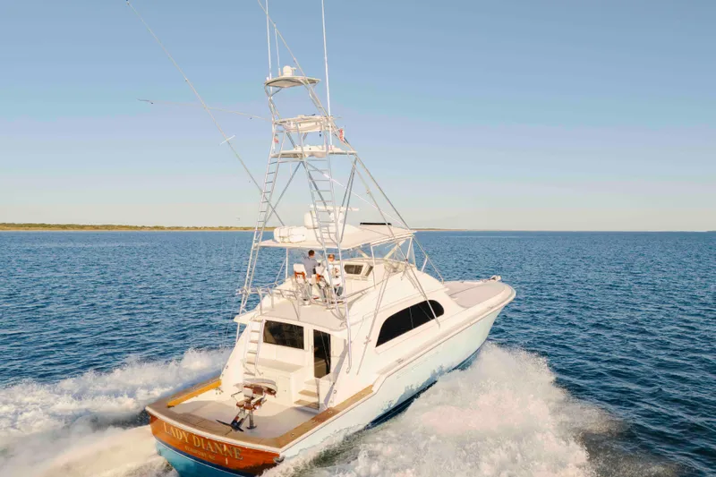 Lady Dianne Yacht Photos Pics 1999 Bertram 60 Convertible yacht cruising on open water.