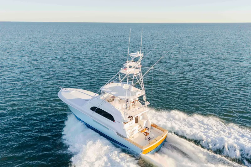 Lady Dianne Yacht Photos Pics 1999 Bertram 60 Convertible yacht cruising on open sea, aerial view.