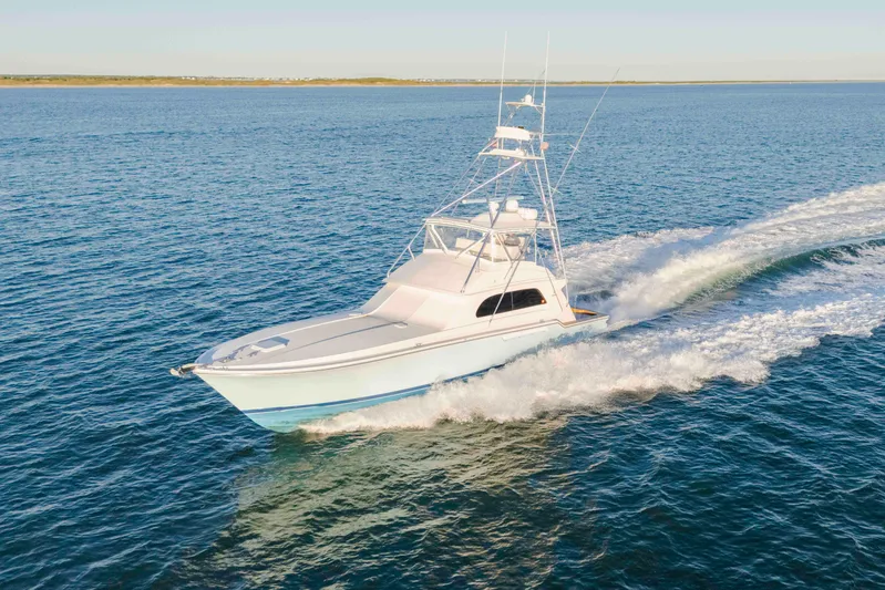 Lady Dianne Yacht Photos Pics 1999 Bertram 60 Convertible yacht cruising on open water.