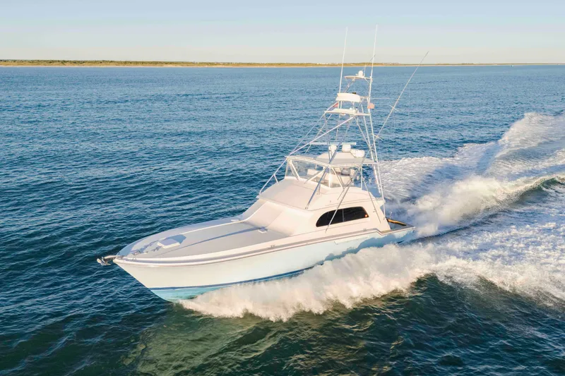 Lady Dianne Yacht Photos Pics 1999 Bertram 60 Convertible yacht cruising on open water.