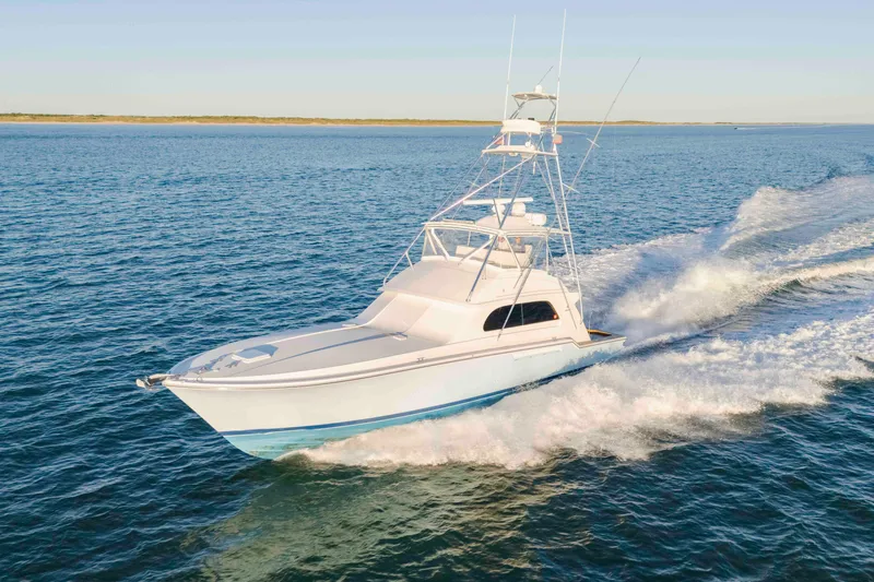 Lady Dianne Yacht Photos Pics 1999 Bertram 60 Convertible yacht cruising on open water.