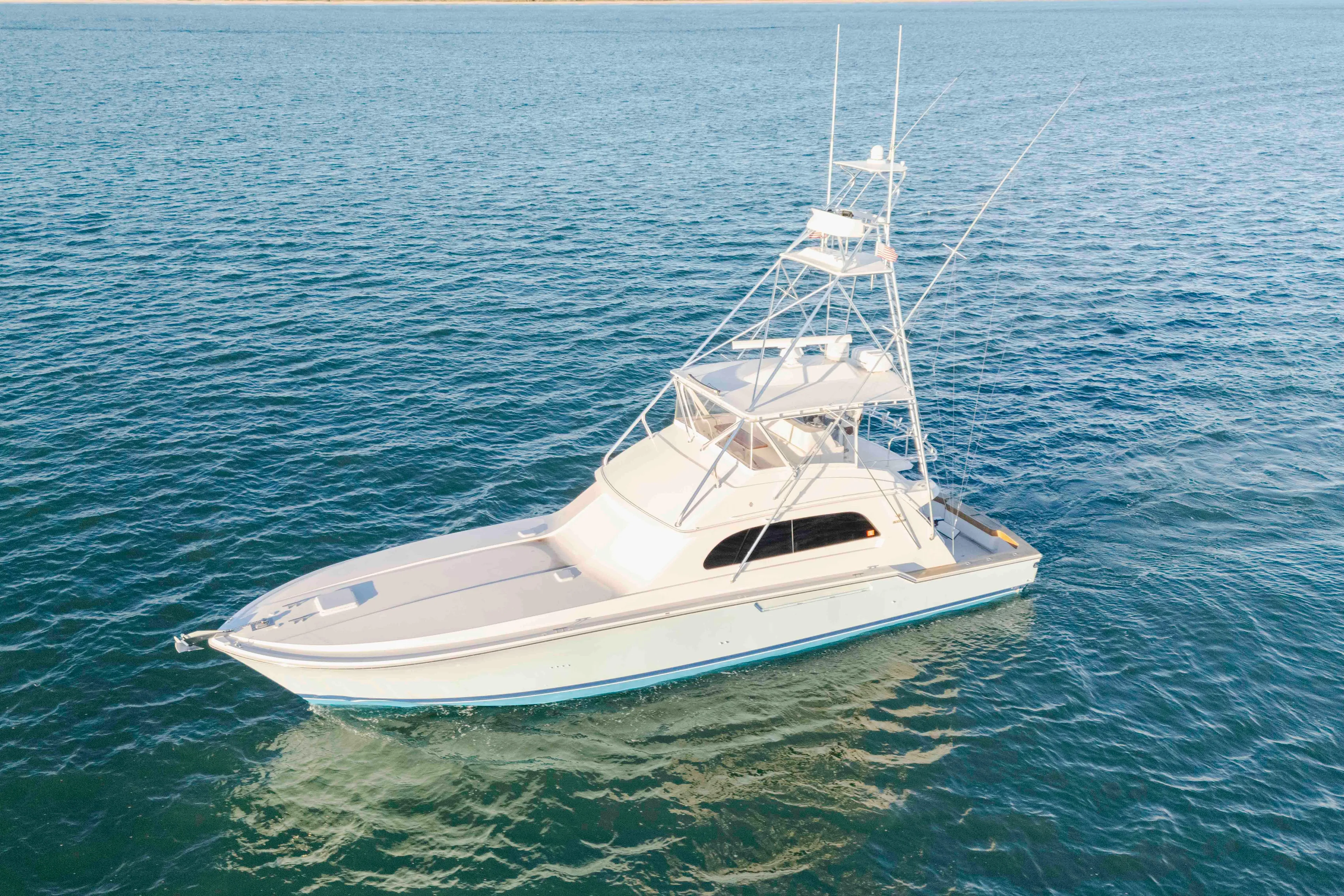 Lady Dianne Yacht Photos Pics 1999 Bertram 60 Convertible yacht cruising on open blue waters.