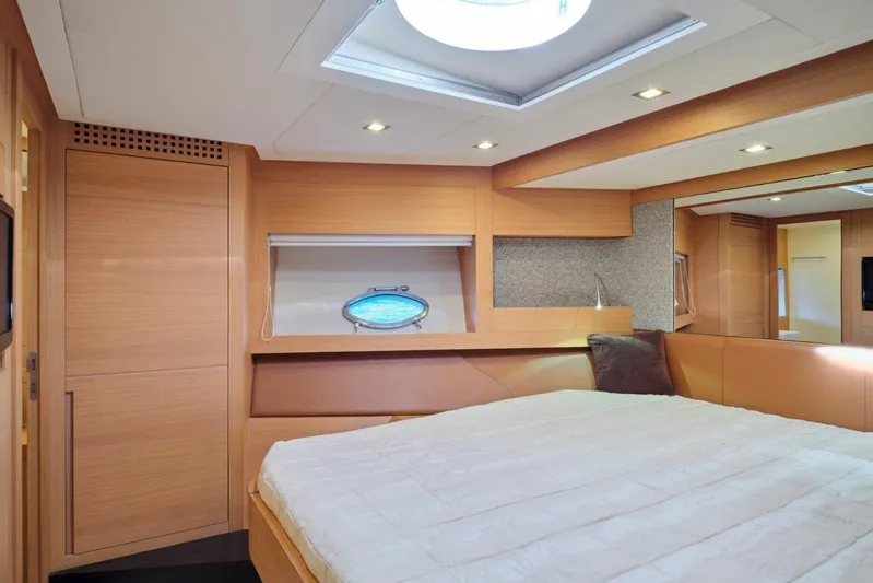 Nickel Yacht Photos Pics Luxurious interior of 2008 Pershing 64 yacht with modern wood finish and skylight.