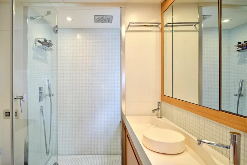 Nickel Yacht Photos Pics Luxurious bathroom in 2008 Pershing 64 yacht with modern shower and sleek vanity.