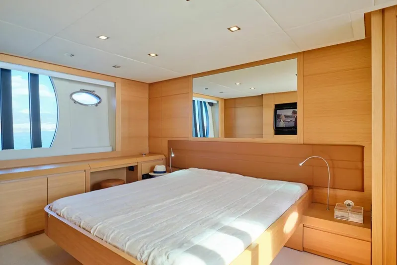 Nickel Yacht Photos Pics Luxurious bedroom interior on 2008 Pershing 64 yacht with modern wood finishes.