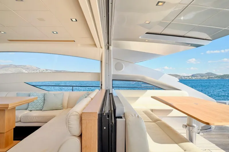 Nickel Yacht Photos Pics Luxurious 2008 Pershing 64 yacht interior with elegant seating and ocean view.