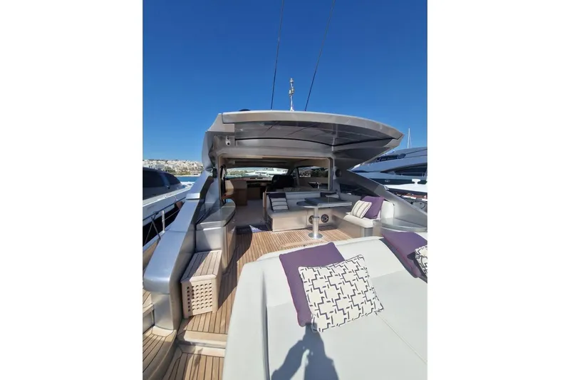 Nickel Yacht Photos Pics 2008 Pershing 64 yacht with luxurious deck seating and modern design.