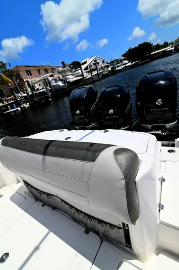  Yacht Photos Pics 2020 Nor-Tech 340 Sport boat with triple Mercury outboard engines docked at marina.
