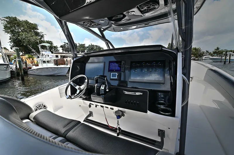  Yacht Photos Pics 2020 Nor-Tech 340 Sport boat cockpit with modern controls and steering wheel.