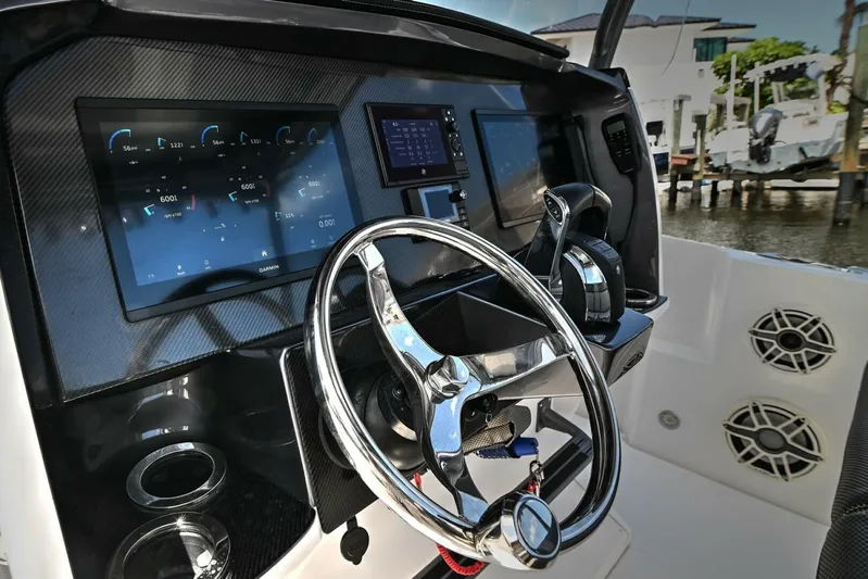  Yacht Photos Pics 2020 Nor-Tech 340 Sport boat dashboard with steering wheel and digital displays.