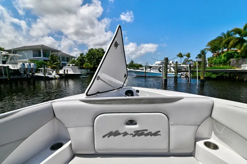  Yacht Photos Pics 2020 Nor-Tech 340 Sport boat docked in a scenic marina with clear skies.