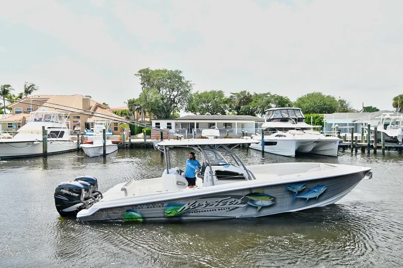  Yacht Photos Pics 2020 Nor-Tech 340 Sport boat docked in a marina with scenic waterfront homes.