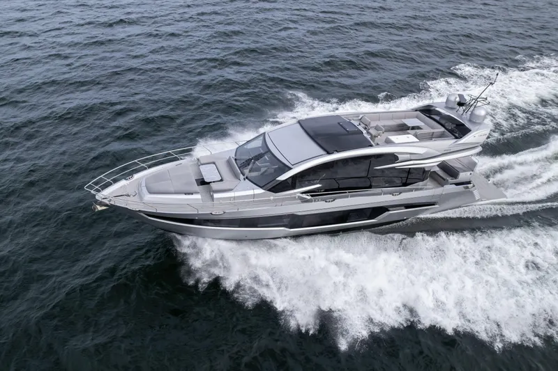 Silver Arrow Yacht Photos Pics 2024 Galeon 700 Sky yacht cruising on open water, showcasing sleek design and luxury features.