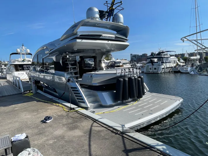 Silver Arrow Yacht Photos Pics 2024 Galeon 700 Sky yacht docked at marina, showcasing sleek design and modern features.