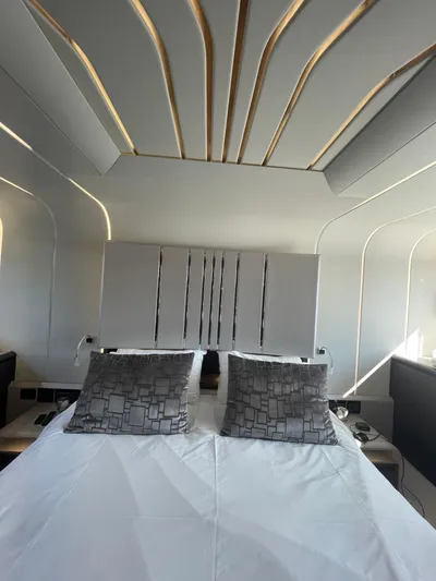 Silver Arrow Yacht Photos Pics Luxurious bedroom interior of 2024 Galeon 700 Sky yacht with modern design and elegant decor.