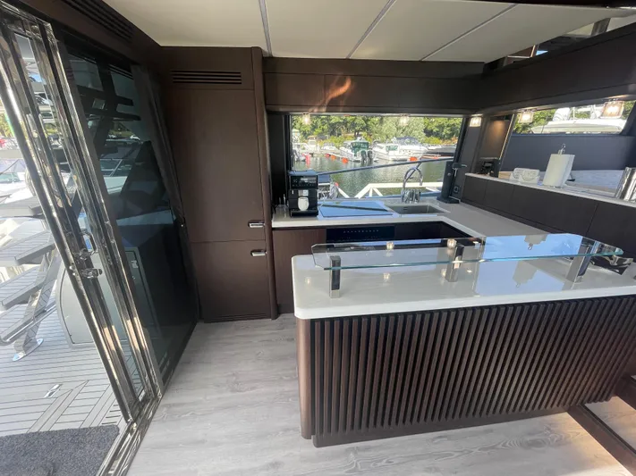 Silver Arrow Yacht Photos Pics Luxurious interior of 2024 Galeon 700 Sky yacht with modern kitchen design.