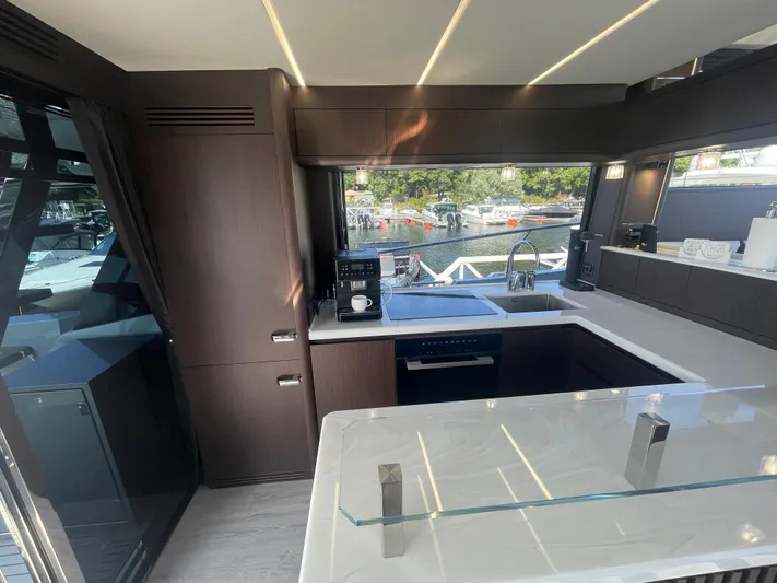 Silver Arrow Yacht Photos Pics Luxurious kitchen interior of 2024 Galeon 700 Sky yacht with modern appliances and sleek design.
