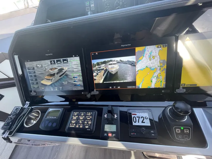 Silver Arrow Yacht Photos Pics 2024 Galeon 700 Sky yacht dashboard with navigation screens and controls.
