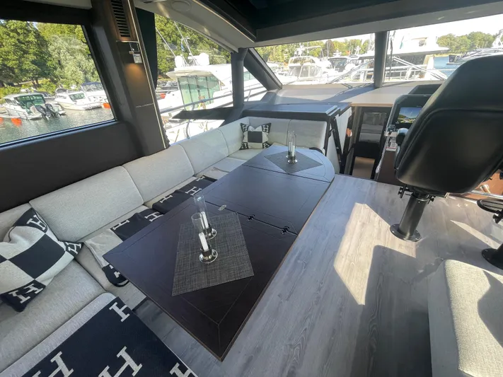 Silver Arrow Yacht Photos Pics Luxurious interior of 2024 Galeon 700 Sky yacht with elegant seating and modern design.