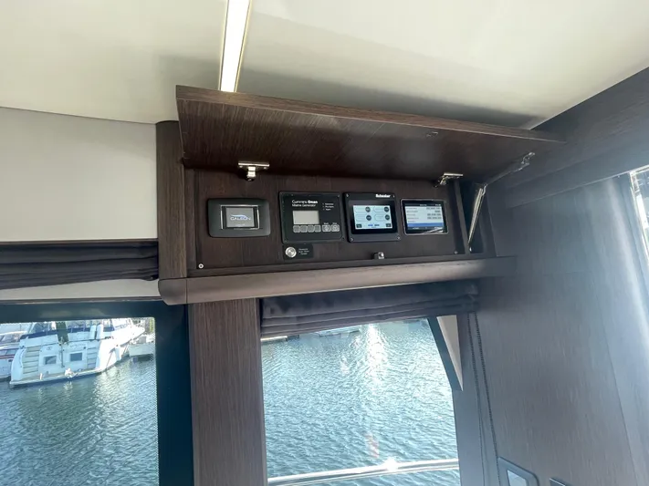 Silver Arrow Yacht Photos Pics Control panel inside 2024 Galeon 700 Sky yacht with water view.