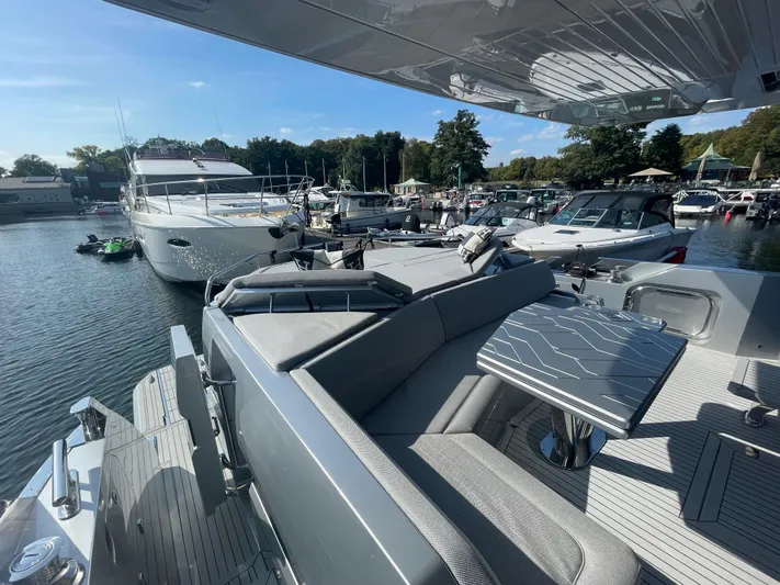 Silver Arrow Yacht Photos Pics 2024 Galeon 700 Sky yacht docked at a marina, showcasing sleek design and luxury features.