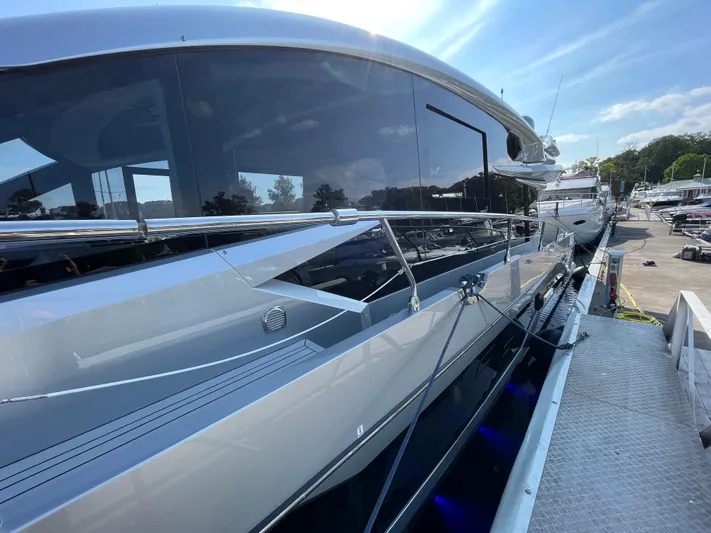 Silver Arrow Yacht Photos Pics 2024 Galeon 700 Sky yacht docked, showcasing sleek design and modern features.