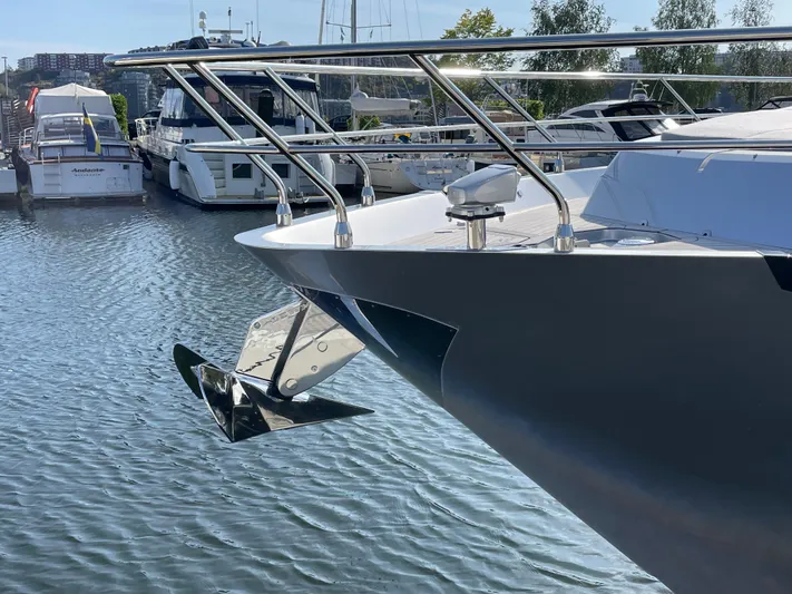 Silver Arrow Yacht Photos Pics 2024 Galeon 700 Sky yacht anchored in marina, showcasing sleek design and modern features.