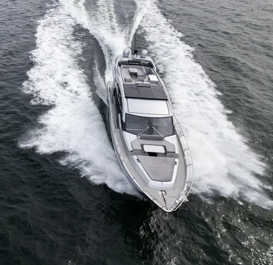 Silver Arrow Yacht Photos Pics 2024 Galeon 700 Sky yacht cruising on open water, aerial view.