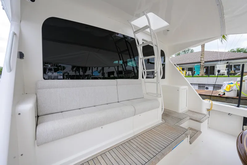  Yacht Photos Pics 2008 Viking 56 Enclosed Bridge yacht with outdoor seating and ladder.