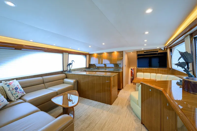  Yacht Photos Pics Luxurious interior of 2008 Viking 56 Enclosed Bridge yacht with elegant wood finishes.