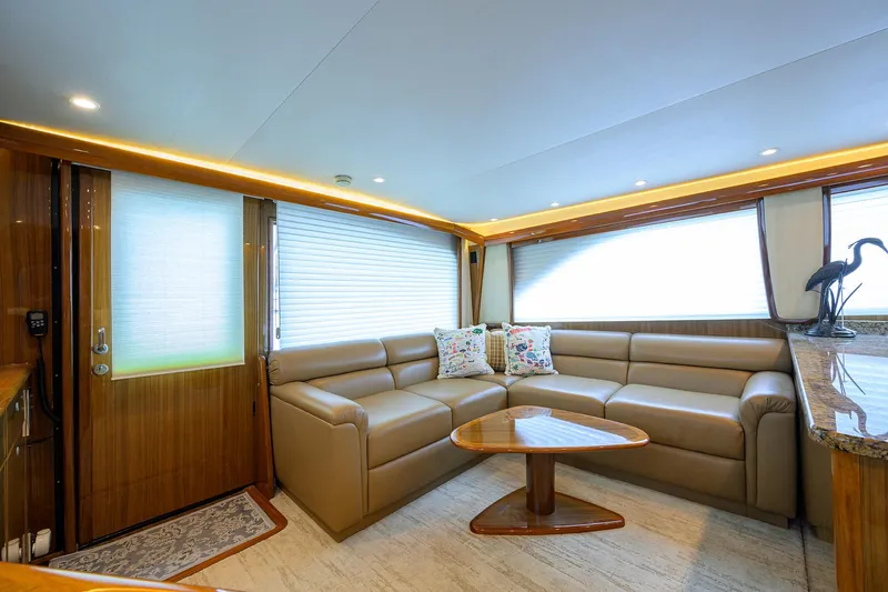  Yacht Photos Pics Luxurious interior of 2008 Viking 56 Enclosed Bridge yacht with leather seating and elegant decor.