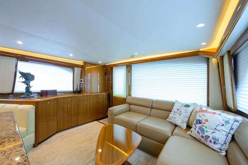  Yacht Photos Pics Luxurious interior of 2008 Viking 56 Enclosed Bridge yacht with plush seating and elegant decor.