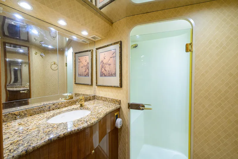  Yacht Photos Pics Luxurious bathroom in 2008 Viking 56 Enclosed Bridge yacht with granite countertop and shower.