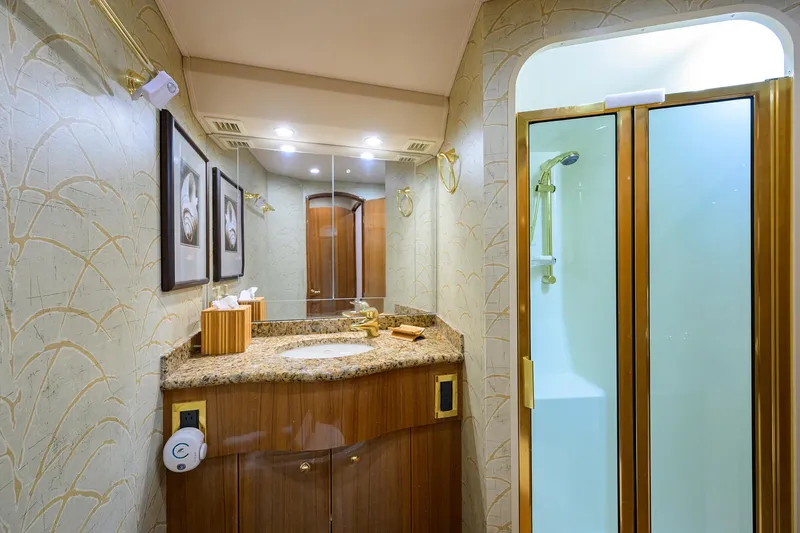  Yacht Photos Pics Luxurious bathroom in 2008 Viking 56 Enclosed Bridge yacht with granite countertop and shower.