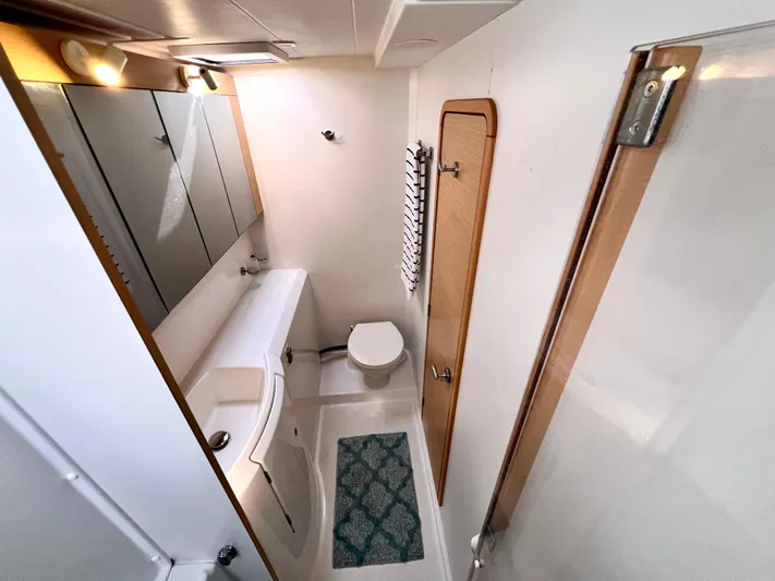 Celestra Yacht Photos Pics Bathroom interior of 2017 Lagoon 400 S2 catamaran, featuring modern fixtures and compact design.