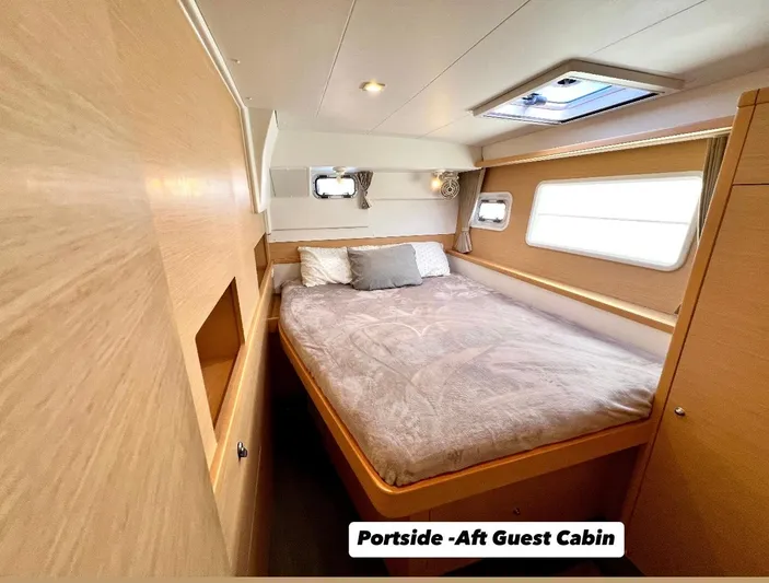 Celestra Yacht Photos Pics Portside aft guest cabin in 2017 Lagoon 400 S2 yacht, featuring cozy bed and natural light.