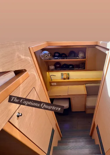 Celestra Yacht Photos Pics Captain's quarters in 2017 Lagoon 400 S2 yacht, featuring wooden interior and storage shelves.