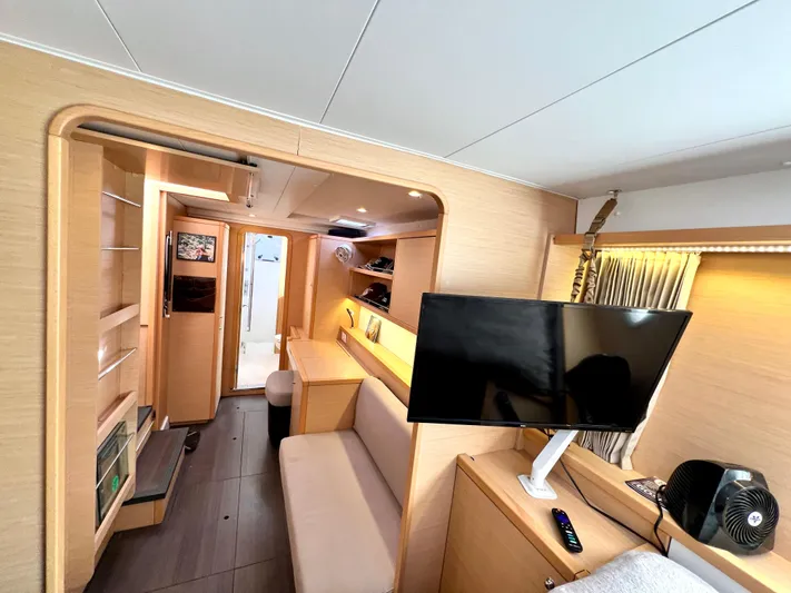 Celestra Yacht Photos Pics Interior of 2017 Lagoon 400 S2 catamaran with modern furnishings and mounted TV.