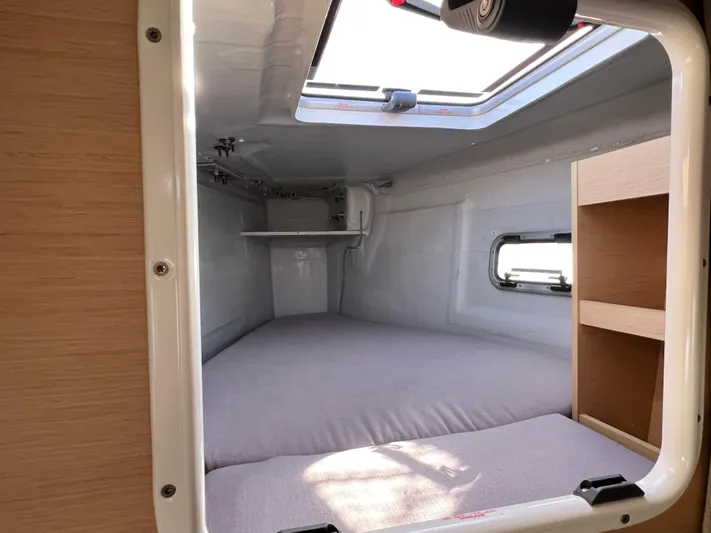 Celestra Yacht Photos Pics Interior cabin of 2017 Lagoon 400 S2 catamaran with bed and window.