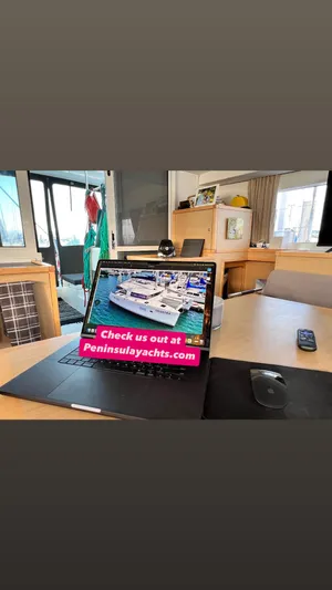 Celestra Yacht Photos Pics Laptop displaying yacht website inside Lagoon 400 S2, 2017 model.