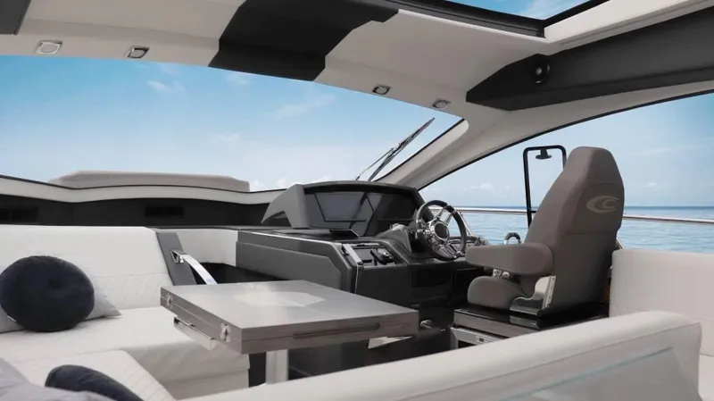  Yacht Photos Pics Luxurious interior of 2025 Cobrey 52 HT yacht with modern helm and seating.