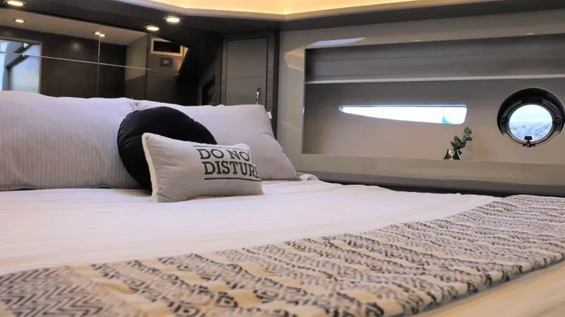  Yacht Photos Pics Luxurious bedroom interior of 2025 Cobrey 52 HT yacht with modern decor.
