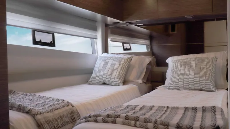  Yacht Photos Pics Luxurious twin cabin interior of 2025 Cobrey 52 HT yacht with modern decor.
