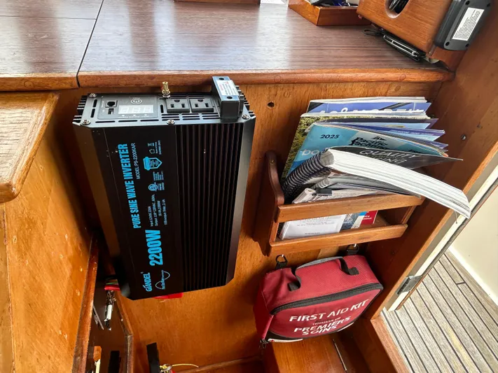 Brie Yacht Photos Pics 1980 Grand Banks 36 Classic interior with inverter, books, and first aid kit.